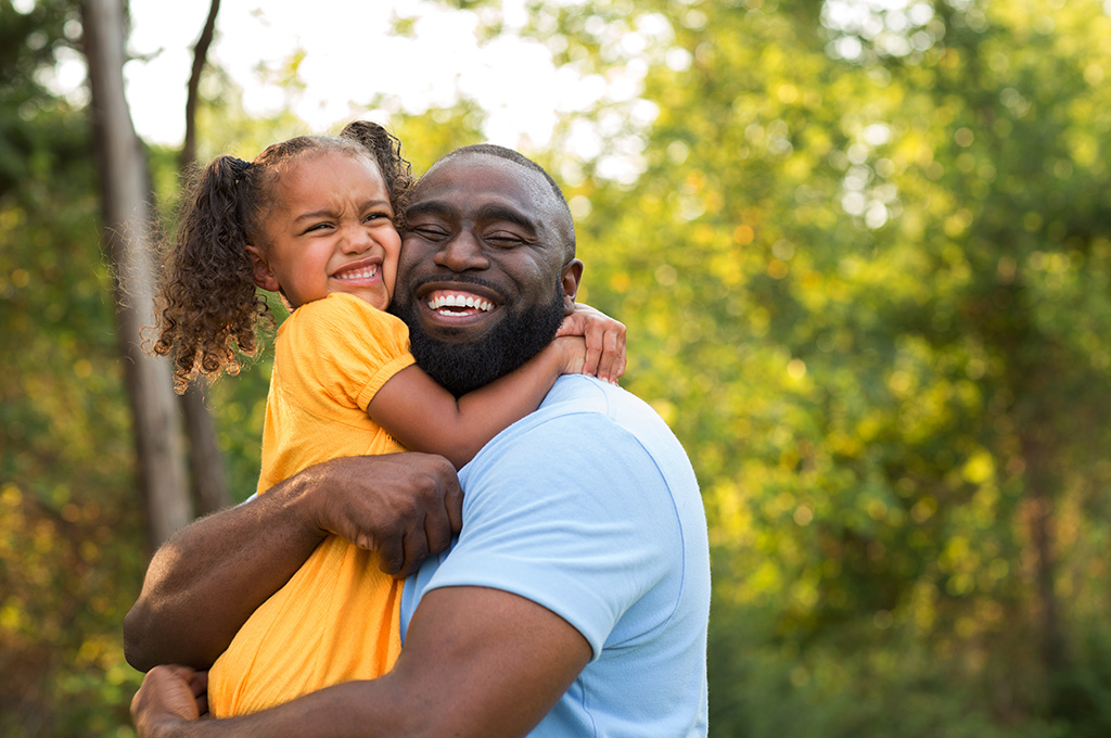 A veteran outside with his child